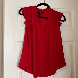 red flowy blouse with ties